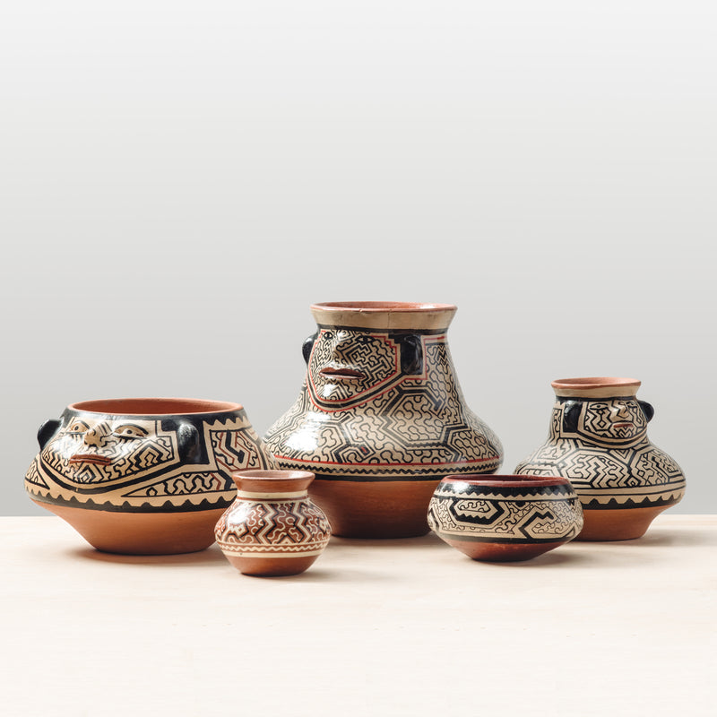 A group of beautiful fair trade pottery bowls and vases.