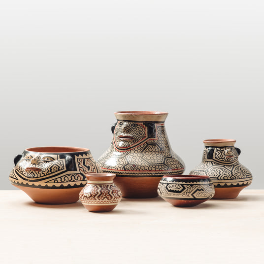 A group of beautiful fair trade pottery bowls and vases.